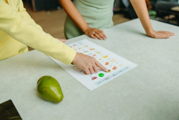 Two adults reviewing printed nutition information