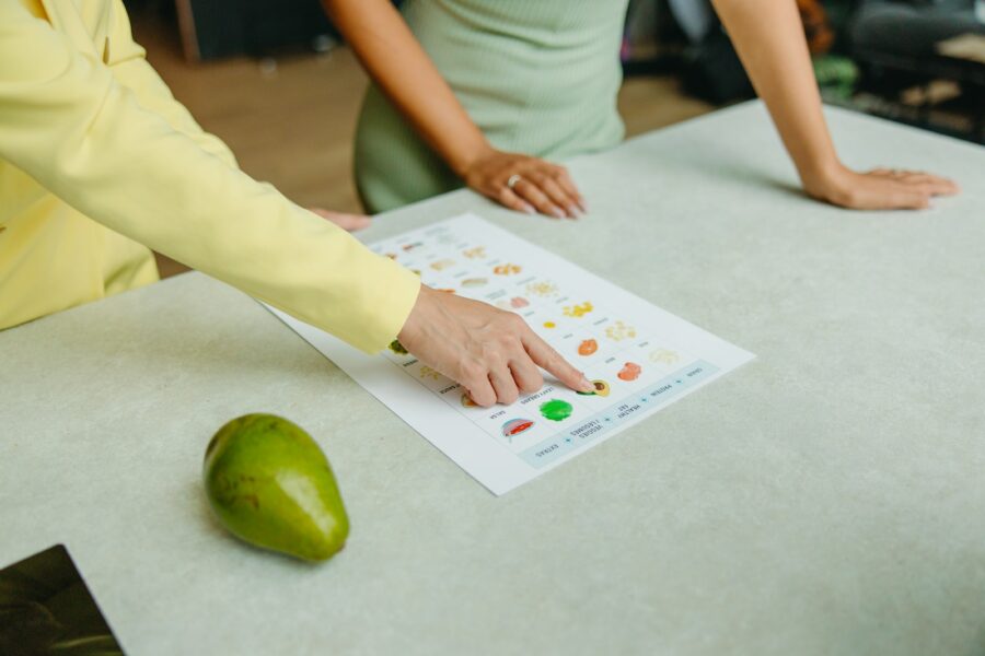 Two adults reviewing printed nutition information